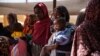 FILE - Women and babies are seen at the Zamzam displacement camp, home to 400,000, in North Darfur, Sudan, in January 2024. Doctors Without Borders found two babies were dying every hour there, and nearly 40% of children 6 months to 2 years old were malnourished.