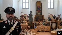 Stolen works of art that were given back by the United States of America to the Italian Carabinieri Command for the Protection of Cultural Heritage are seen during a press event in Rome, May 28, 2024. (AP Photo/Gregorio Borgia)