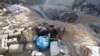 Palestinians inspect the site of an Israeli strike on a house, amid the conflict between Israel and the Palestinian Islamist group Hamas, in Rafah, in the southern Gaza Strip, May 8, 2024.