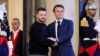 Ukraine's President Volodymyr Zelensky (L) is welcomed by France's President Emmanuel Macron 