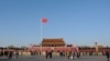 FILE - A Chinese flag flutters against blue sky in Tiananmen Square in Beijing, China, Dec. 24, 2017. 