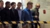 FILE - U.S. Marine Pfc. Joseph Scott Pemberton, third left, the suspect in the killing of Filipino transgender Jennifer Laude, is escorted into the courtroom for his scheduled trial, March 23, 2015, at Olongapo city, Zambales province, northwest of Manila.