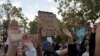Demonstrators raise their arms during a protest against the death of African-American man George Floyd under Minneapolis police custody, in Oakland, California, U.S. May 29, 2020. REUTERS/Stephen Lam