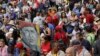 Partidarios del gobierno sostienen una pintura del fallecido presidente venezolano Hugo Chávez, durante un evento que marca el aniversario del golpe de 1958, en Caracas, Venezuela, el martes 23 de enero de 2024. (Foto AP/Jesús Vargas)