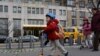 Children pass by a Trump Place building, part of an apartment complex on the Upper West Side of Manhattan, in New York December 9, 2015. 