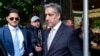 Michael Cohen sale de su edificio de apartamentos de camino al tribunal penal de Manhattan, el lunes 13 de mayo de 2024, en Nueva York. 