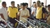 Moro Islamic Liberation Front Chairman Al Haj Murad Ebrahim (C) shows Philippine President Benigno Aquino (R) weapons turned in by Front rebels in Sultan Kudarat, Maguindanao Province, the Philippines, June 16, 2015. (VOA/Simone Orendain)