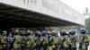 Members of the Philippine National Police Special Action Force conduct a raid to simulate an attack as part of heightened security efforts leading up to next week's APEC (Asia Pacific Economic Cooperation) Summit in Manila, Nov. 14, 2015.
