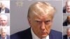 A combination picture shows police booking mugshots of former U.S. President Trump and the 18 people indicted with him