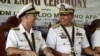 Philippine Navy Rear Admiral Leopoldo Alano (R) shares a light moment with U.S. Navy Rear Admiral William Merz during the opening ceremony of the Cooperation Afloat Readiness and Training (CARAT) 2015 at navy headquarters in Puerto Princesa city, Palawan