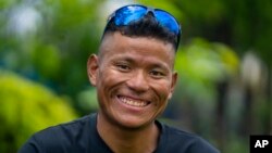 Nepali climbing guide Tenjen Sherpa, 35, poses during an interview with the Associated Press in Kathmandu, Nepal, Wednesday, August 9, 2023. (AP Photo/Niranjan Shrestha)