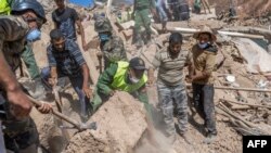 Emergency personnel continue rescue operations in the mountainous area of Tizi N'Test, in the Taroudant province, one of the most devastated in quake-hit Morocco, on September 11, 2023. (Photo by BULENT KILIC / AFP)