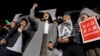 被取消竞选资格的香港自决派团体“香港众志”的常委周庭和支持者在“反对政治筛选集会”中喊口号（2018年1月28日）
