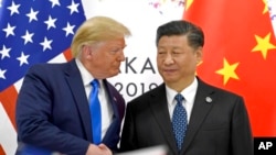 美国总统特朗普与中国国家主席习近平在大阪G-20峰会握手。 （2019年6月29日）