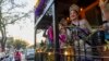 Louisiana festival queens from across the state ride in a float during the Krewe of Bacchus parade in New Orleans, March 2, 2025.