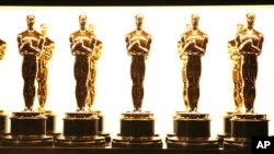 FILE - Oscar statuettes appear backstage at the Oscars in Los Angeles on Feb. 26, 2017.