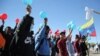 Migrantes venezolanos participan en una protesta pidiendo a las autoridades de EEUU que no apliquen el Título 42 a los venezolanos, cerca de la frontera entre México y EEUU, en Ciudad Juárez, el 6 de noviembre de 2022. REUTERS/Gabriel Barraza 