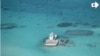In this photo taken Feb. 28, 2013 by a surveillance plane, and released Thursday, May 15, 2014, by the Philippine Department of Foreign Affairs, Chinese-made structures stands on the Johnson Reef, called Mabini by the Philippines and Chigua by China, in t