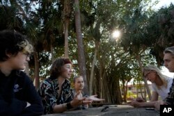 New College of Florida students, from left, Niko Jackson, Viv Cargille, Olivia Pare, Willem Aspinall, and Riley Wood, discuss how changes to the school are affecting their college experience, during a meeting with Associated Press journalists on the New College of Florida campus, Thursday, March 2, 2023, in Sarasota, Fla. (AP Photo/Rebecca Blackwell)