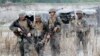 FILE - U.S. troops are seen on patrol during joint U.S.-Philippines military exercises in Tarlac province, north of Manila.