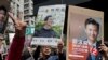 姚松炎和郑泳舜双方的支持者（2018年3月11日）。原立法会功能组别议员姚松炎出战九龙西选区，但以两千多票败给亲中的民建联的郑泳舜。