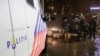 FILE - Police officers stand guard following an announcement of new measures to fight a record surge in COVID-19 infections, in The Hague, Netherlands, Nov. 26, 2021.