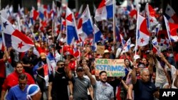 People protest during a march against the government contract with Canadian mining company First Quantum and its subsidiary Minera Panama in Panama City on November 3, 2023.