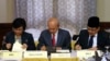 Government of the Philippines (GPH) chief negotiator Miriam Coronel Ferer (L) and Moro Islamic Liberation Front (MILF) chief negotiator Mohagher Iqbal (R) sign the peace agreement between both parties with AB Ghafar Tengku Mohamed as a witness from Malays